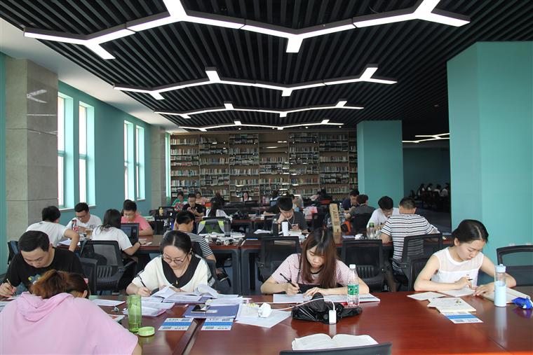 Students studying together in a library